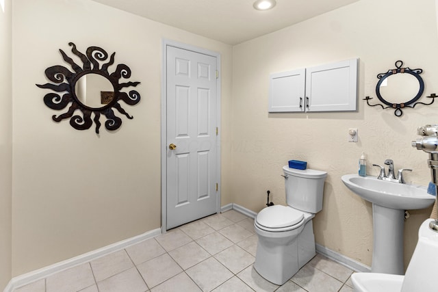 251 Longbranch Dr, Dublin, OH 43017 - bathroom featuring toilet, tile patterned flooring, baseboards, and a sink