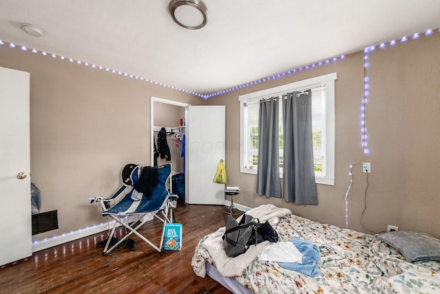 922-924 Geers Ave, Columbus, OH 43206 - bedroom with wood finished floors, a spacious closet, baseboards, and a closet