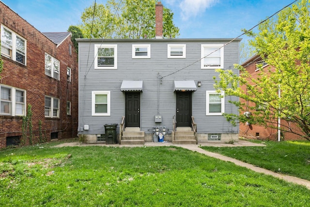 922-924 Geers Ave, Columbus, OH 43206 - back of house featuring entry steps, a yard, and a chimney