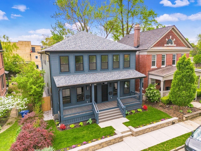 1177 Franklin Ave, Columbus, OH 43205 - view of front facade featuring a porch, roof with shingles, and a chimney