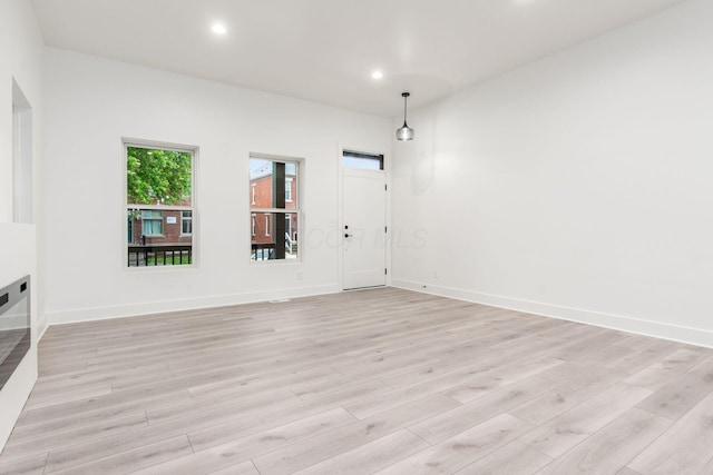 1177 Franklin Ave, Columbus, OH 43205 - unfurnished living room featuring light wood-style flooring, baseboards, and recessed lighting