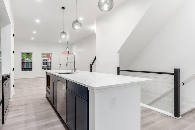 1177 Franklin Ave, Columbus, OH 43205 - kitchen with a sink, light wood-style floors, recessed lighting, a center island with sink, and hanging light fixtures