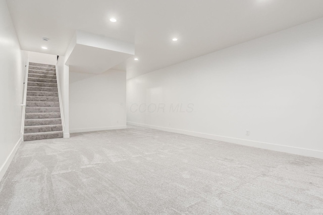 1177 Franklin Ave, Columbus, OH 43205 - empty room with light carpet, baseboards, recessed lighting, and stairway