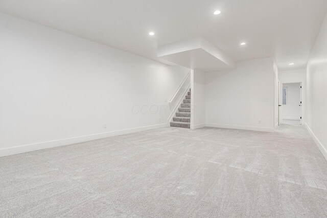 1177 Franklin Ave, Columbus, OH 43205 - unfurnished living room featuring stairway, light colored carpet, recessed lighting, and baseboards