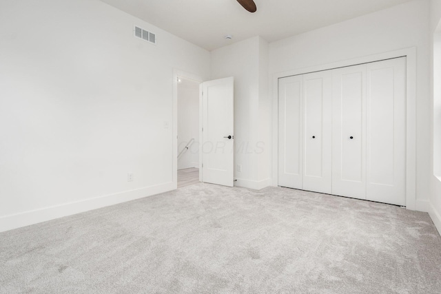 1177 Franklin Ave, Columbus, OH 43205 - unfurnished bedroom featuring carpet flooring, baseboards, a closet, and ceiling fan