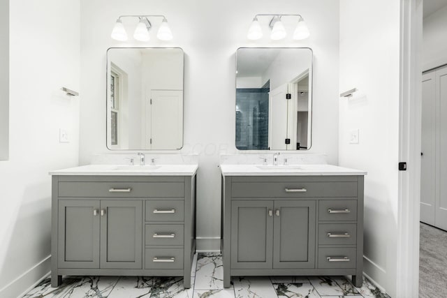 1177 Franklin Ave, Columbus, OH 43205 - full bath with marble finish floors, two vanities, and baseboards
