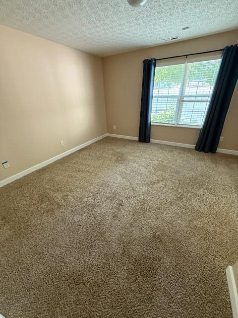 6983 Remsen Dr Unit 77A, Canal Winchester, OH 43110 - carpeted spare room featuring a textured ceiling and baseboards