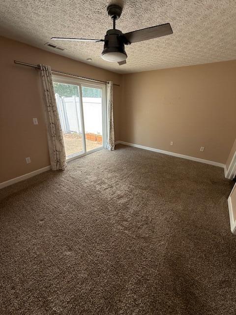 6983 Remsen Dr Unit 77A, Canal Winchester, OH 43110 - spare room featuring a textured ceiling, carpet flooring, baseboards, and a ceiling fan