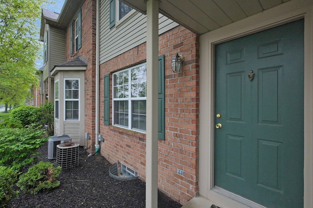 2999 Glenloch Cir, Dublin, OH 43017 - doorway to property with brick siding and central air condition unit