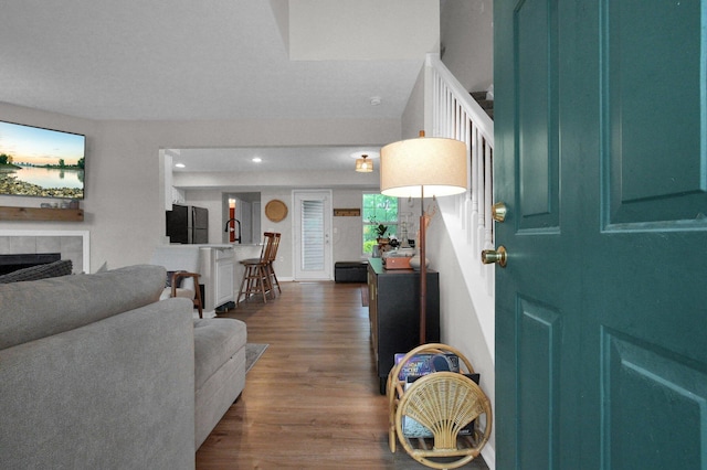 2999 Glenloch Cir, Dublin, OH 43017 - entryway with dark wood-type flooring, a fireplace, and recessed lighting