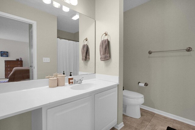 2999 Glenloch Cir, Dublin, OH 43017 - bathroom with toilet, vanity, tile patterned flooring, and baseboards