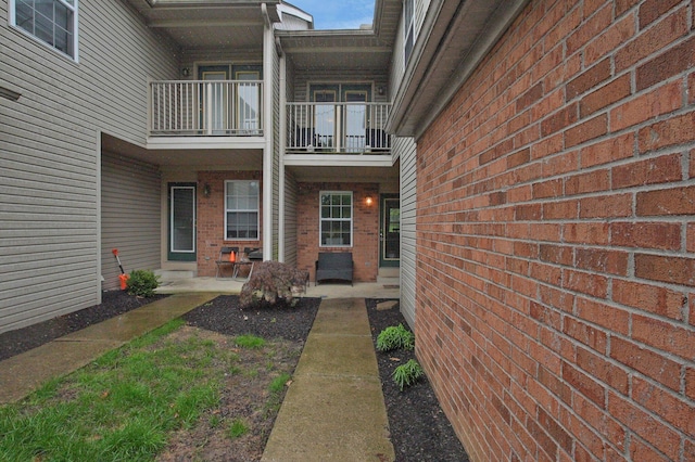 2999 Glenloch Cir, Dublin, OH 43017 - view of exterior entry featuring a balcony and brick siding