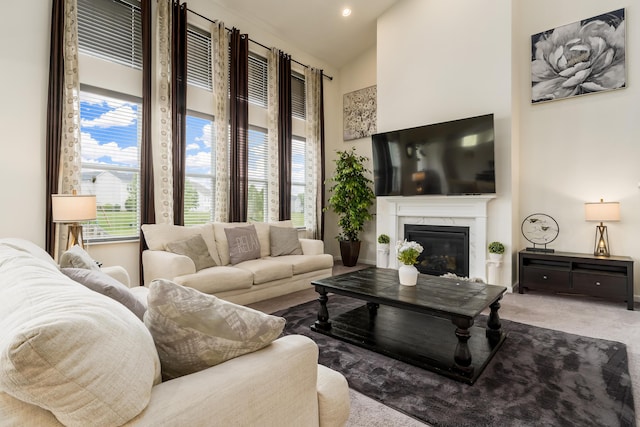 8123 Comstock Ter NW, Pickerington, OH 43147 - carpeted living area featuring a high end fireplace and vaulted ceiling