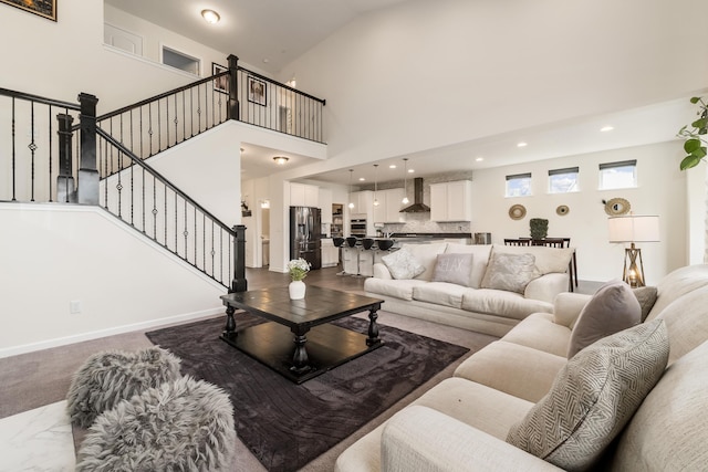 8123 Comstock Ter NW, Pickerington, OH 43147 - living room featuring recessed lighting, stairs, baseboards, and high vaulted ceiling