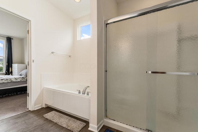 8123 Comstock Ter NW, Pickerington, OH 43147 - bathroom featuring connected bathroom, healthy amount of natural light, wood finished floors, and a shower stall