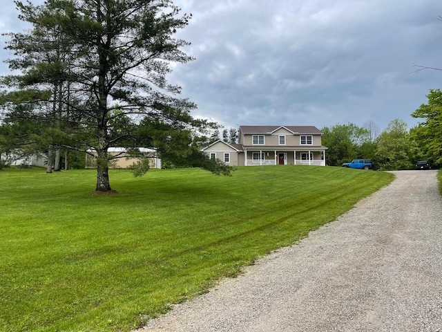 7719 Bear Run Rd, Logan, OH 43138 - view of front facade featuring gravel driveway, a front yard, and covered porch