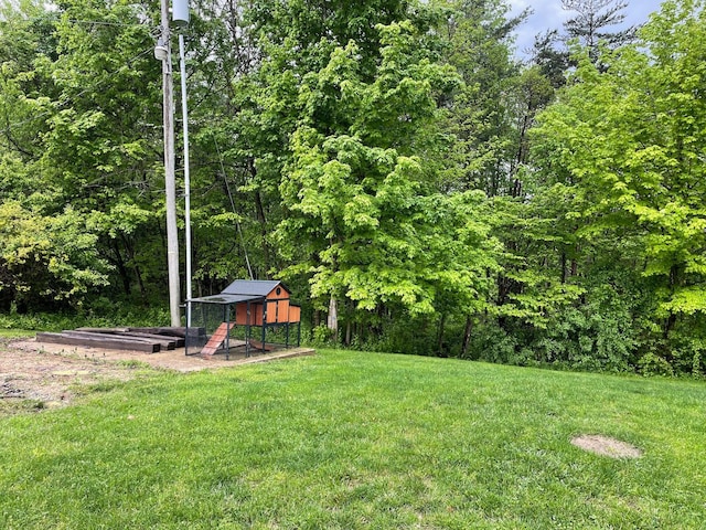 7719 Bear Run Rd, Logan, OH 43138 - view of green lawn with an outbuilding