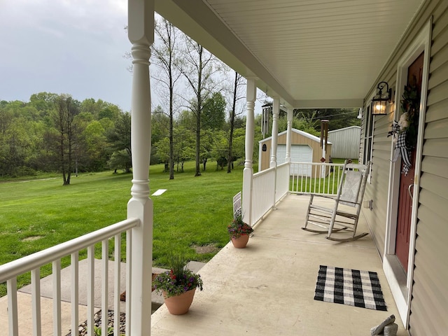7719 Bear Run Rd, Logan, OH 43138 - view of patio / terrace with an outbuilding and covered porch
