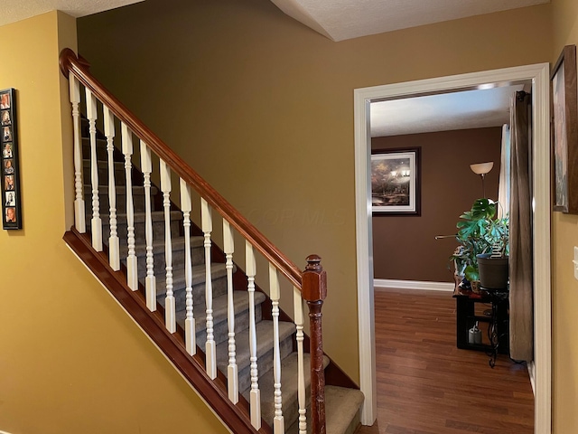 7719 Bear Run Rd, Logan, OH 43138 - staircase with wood finished floors and baseboards