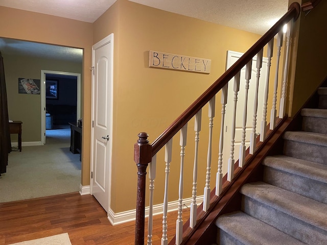 7719 Bear Run Rd, Logan, OH 43138 - staircase with wood finished floors and baseboards