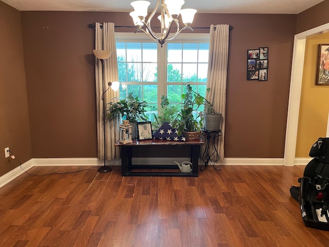 7719 Bear Run Rd, Logan, OH 43138 - dining room with a chandelier, baseboards, and wood finished floors
