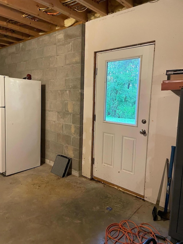 7719 Bear Run Rd, Logan, OH 43138 - basement featuring freestanding refrigerator and concrete block wall