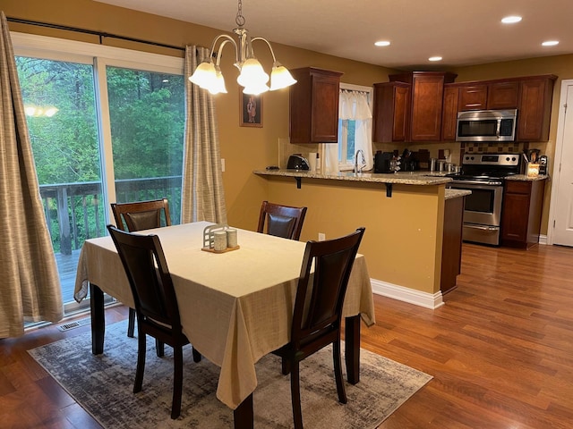 7719 Bear Run Rd, Logan, OH 43138 - dining space featuring recessed lighting, dark wood-style floors, and a chandelier