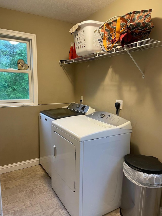 7719 Bear Run Rd, Logan, OH 43138 - laundry area featuring independent washer and dryer, baseboards, and light stone finish flooring