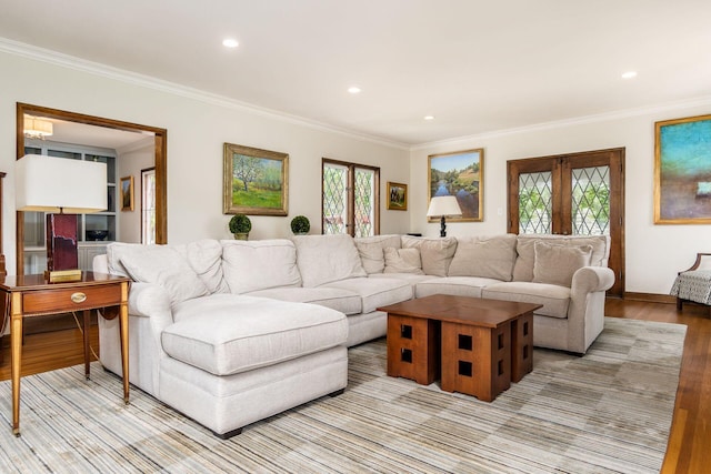 living room featuring crown molding, light wood finished floors, recessed lighting, and french doors