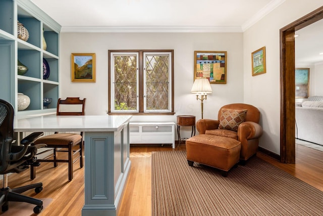 home office with wood finished floors and ornamental molding