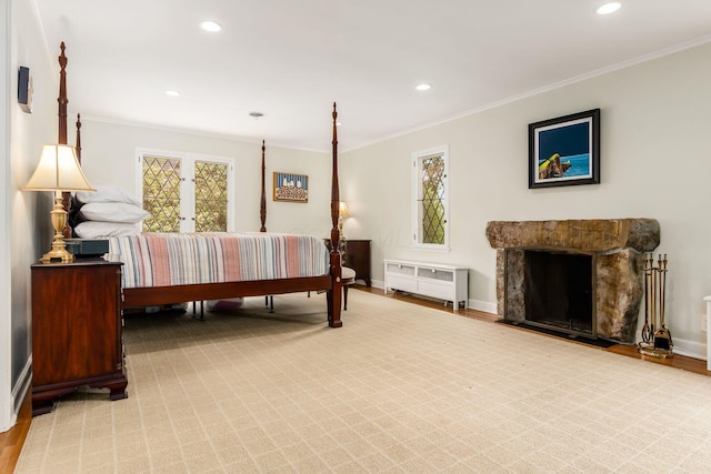 bedroom with ornamental molding, recessed lighting, baseboards, and a fireplace