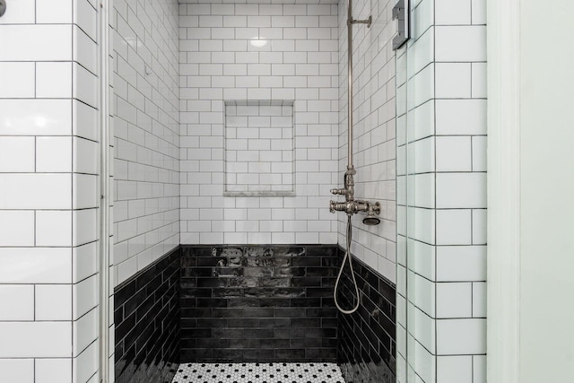 bathroom with a tile shower