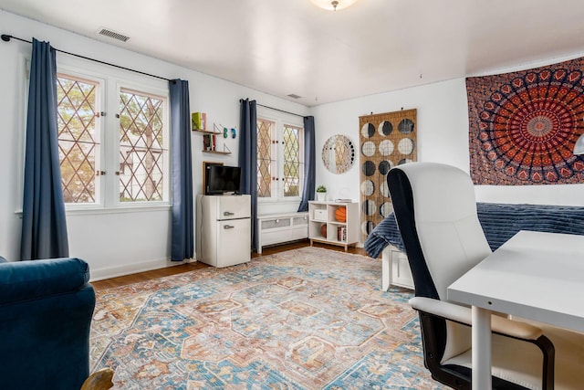 home office with wood finished floors