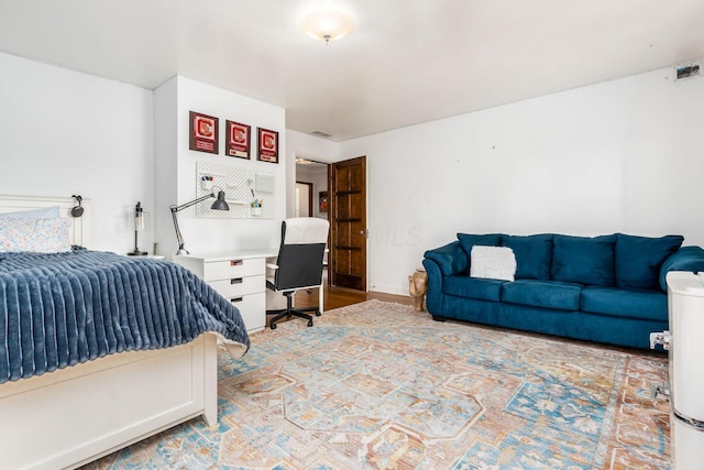 bedroom with an office area