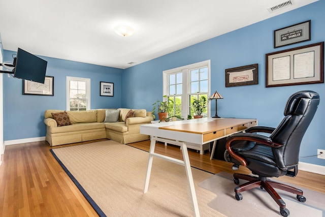office area featuring wood finished floors and baseboards