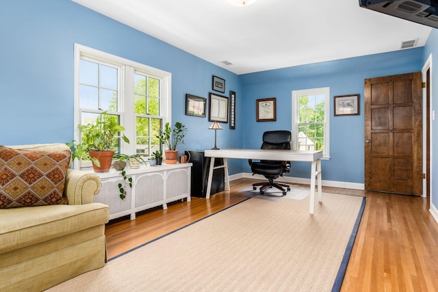 office featuring wood finished floors and baseboards