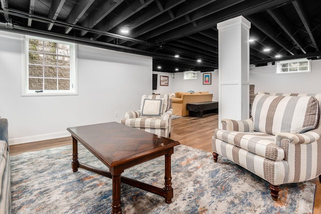 living area featuring wood finished floors and baseboards