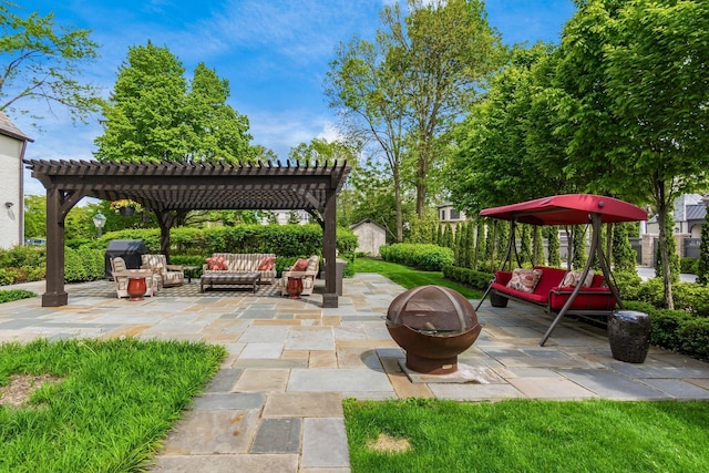 view of patio featuring an outdoor living space with a fire pit, a pergola, a storage unit, and an outdoor structure