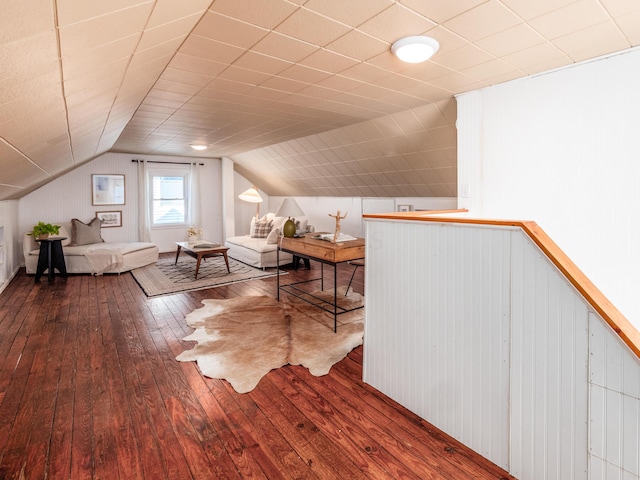 bonus room with hardwood / wood-style floors and lofted ceiling