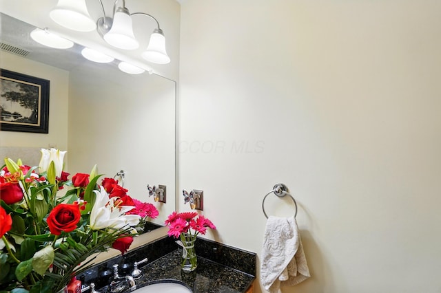 8380 Squad Dr, Galloway, OH 43119 - bathroom with a chandelier and vanity