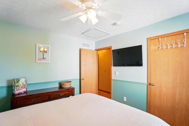 8380 Squad Dr, Galloway, OH 43119 - bedroom featuring a textured ceiling, ceiling fan, and attic access