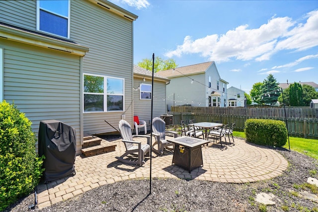 8380 Squad Dr, Galloway, OH 43119 - view of patio featuring fence, an outdoor fire pit, and a grill