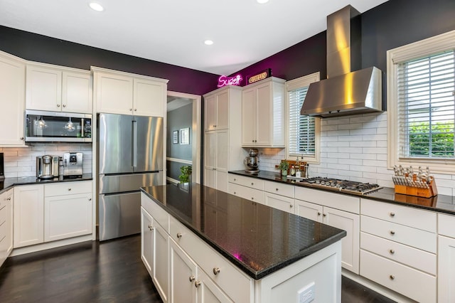 4166 Borge Way, Dublin, OH 43016 - kitchen featuring appliances with stainless steel finishes, wall chimney exhaust hood, decorative backsplash, recessed lighting, and a kitchen island