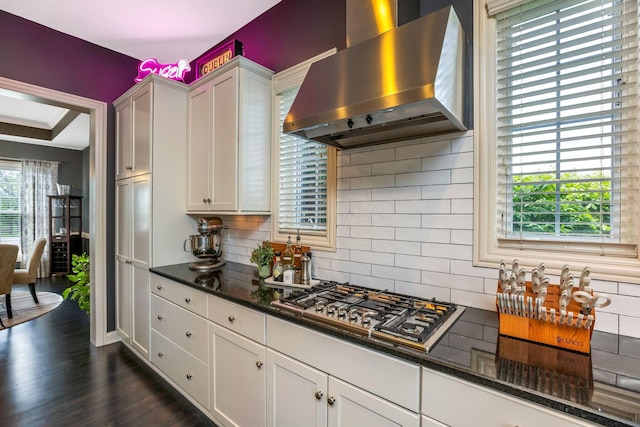 4166 Borge Way, Dublin, OH 43016 - kitchen with wall chimney exhaust hood, stainless steel gas stovetop, white cabinetry, and decorative backsplash