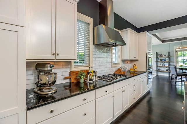 4166 Borge Way, Dublin, OH 43016 - kitchen featuring stainless steel appliances, wall chimney range hood, decorative backsplash, and white cabinetry