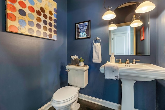 4166 Borge Way, Dublin, OH 43016 - half bathroom featuring baseboards, toilet, and wood finished floors