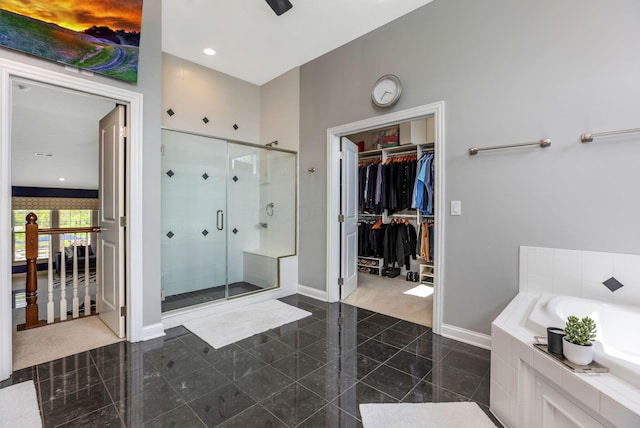 4166 Borge Way, Dublin, OH 43016 - bathroom with granite floors, a shower stall, baseboards, a garden tub, and a walk in closet