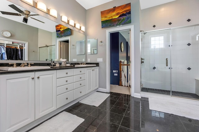 4166 Borge Way, Dublin, OH 43016 - bathroom featuring double vanity, a shower stall, a spacious closet, and a ceiling fan