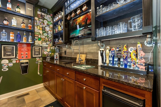 4166 Borge Way, Dublin, OH 43016 - indoor bar with tasteful backsplash, light tile patterned floors, and baseboards