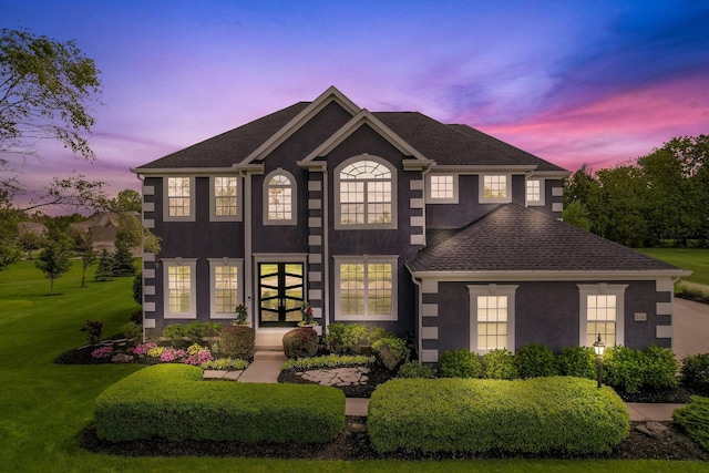 4166 Borge Way, Dublin, OH 43016 - colonial-style house featuring stucco siding, french doors, a yard, and a shingled roof